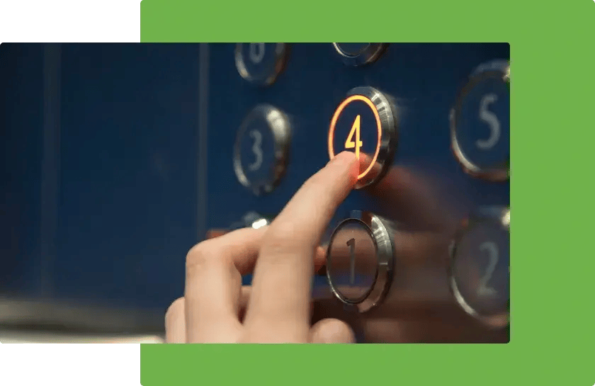Someone pushing a button on a lift
