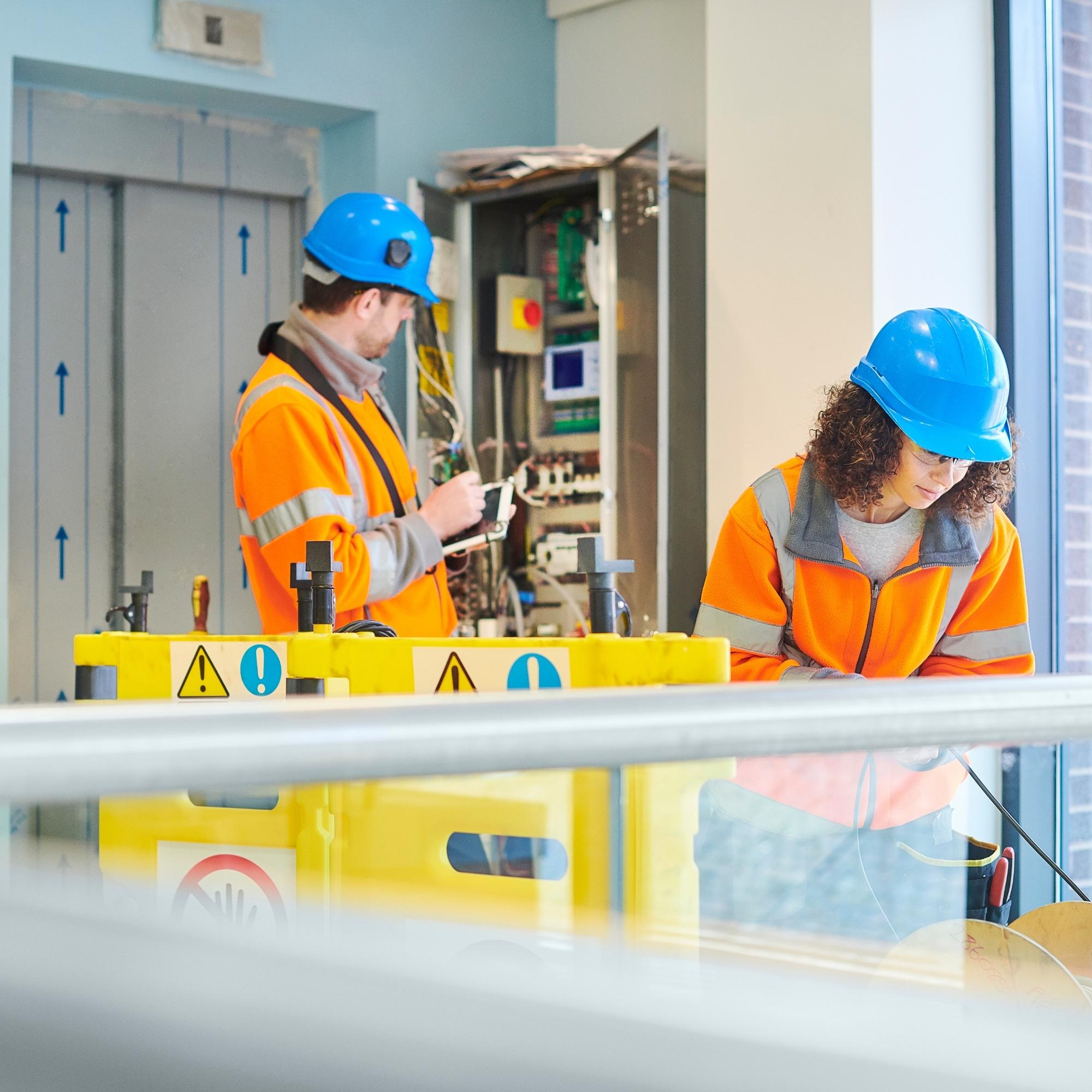 Lift engineers conducting an inspection for LOLER Regulations