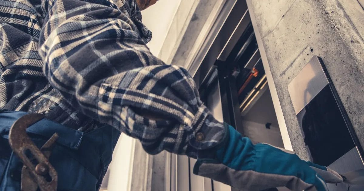 A health and safety inspector assessing a lift