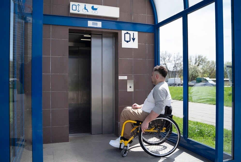 Disabled man waiting for a lift