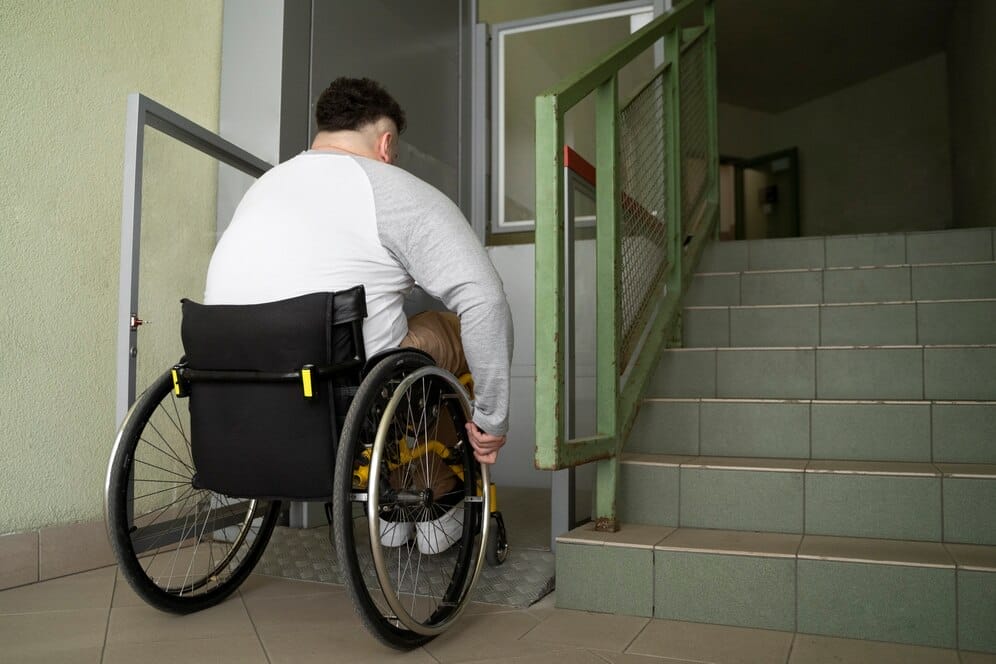 Disabled man waiting for a lift